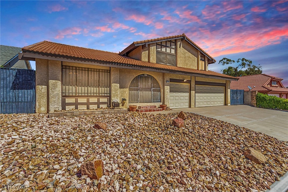 View of front of home featuring fence, stucco sidi