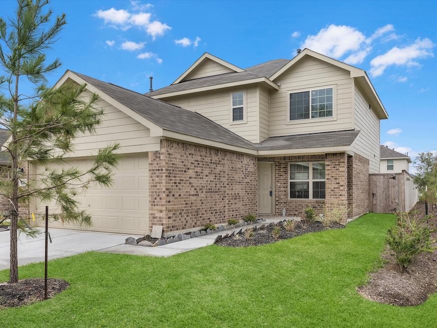 Lush green lawn, landscaping and pine tree add cur