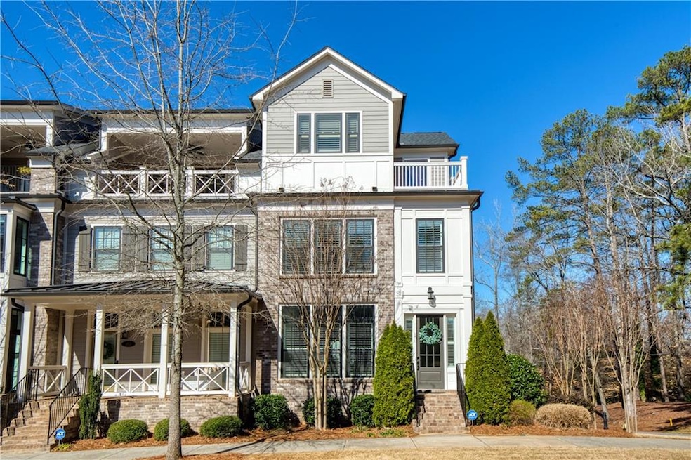 This elegant four-story end-unit townhome is situa