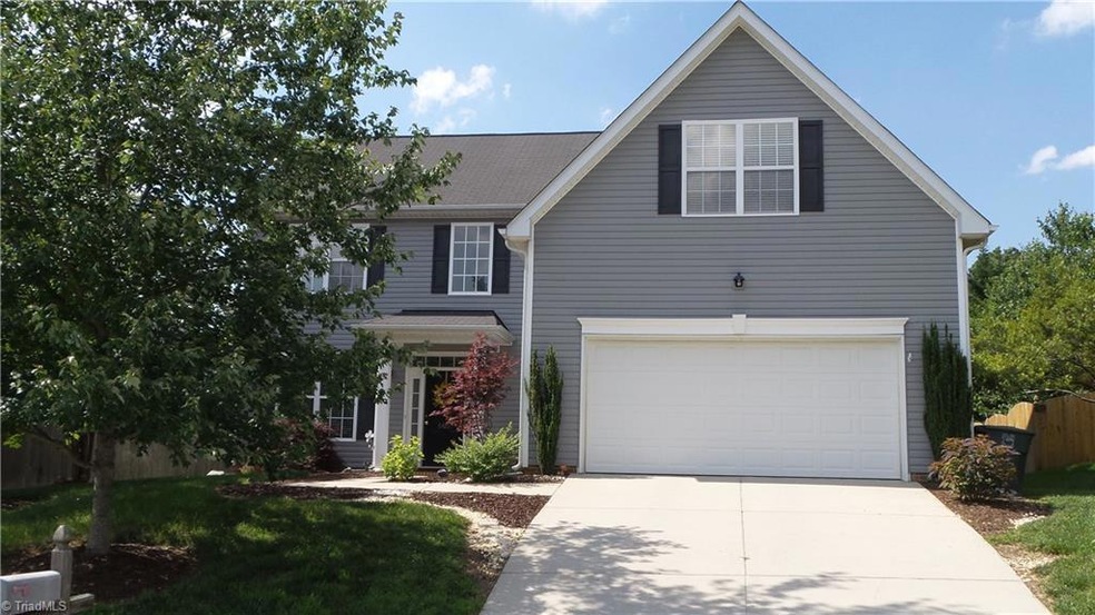 Welcome Home to 6420 Rock Springs Road!  Nice landscaped entryway to covered front porch.