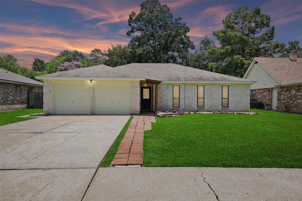 This charming single-story home features a two-car