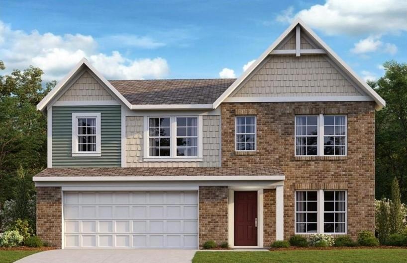 View of front facade featuring a front lawn and a 