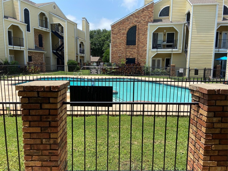 View of swimming pool featuring a yard directly in