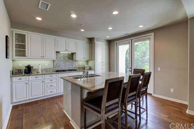 Custom kitchen cabinets with stainless oversized i