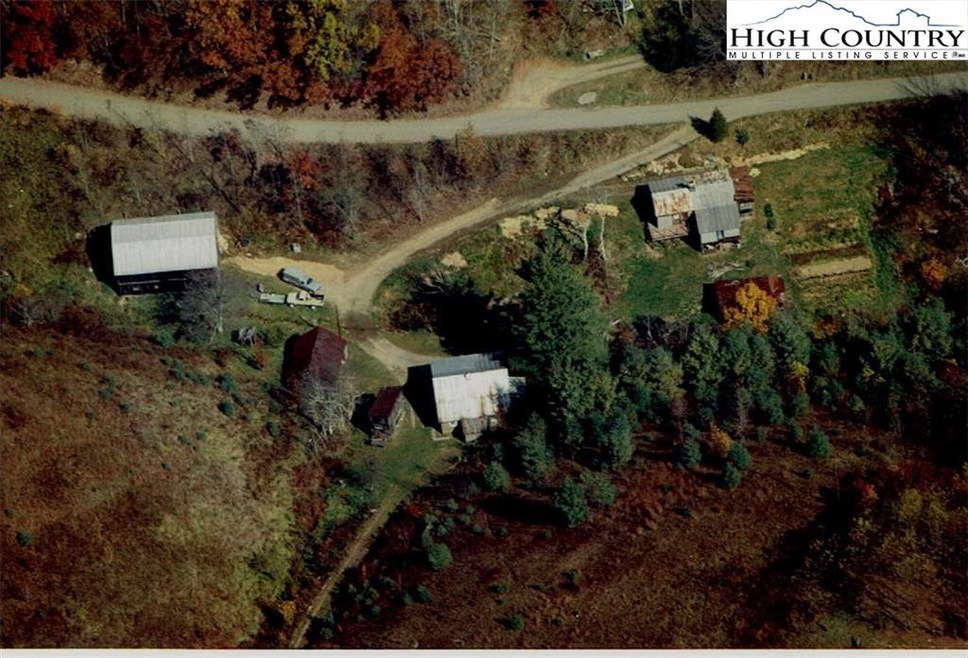 Aerial view, two homes and tobacco barn