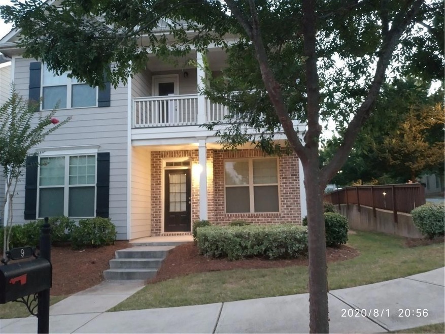 View of front of home with a balcony
