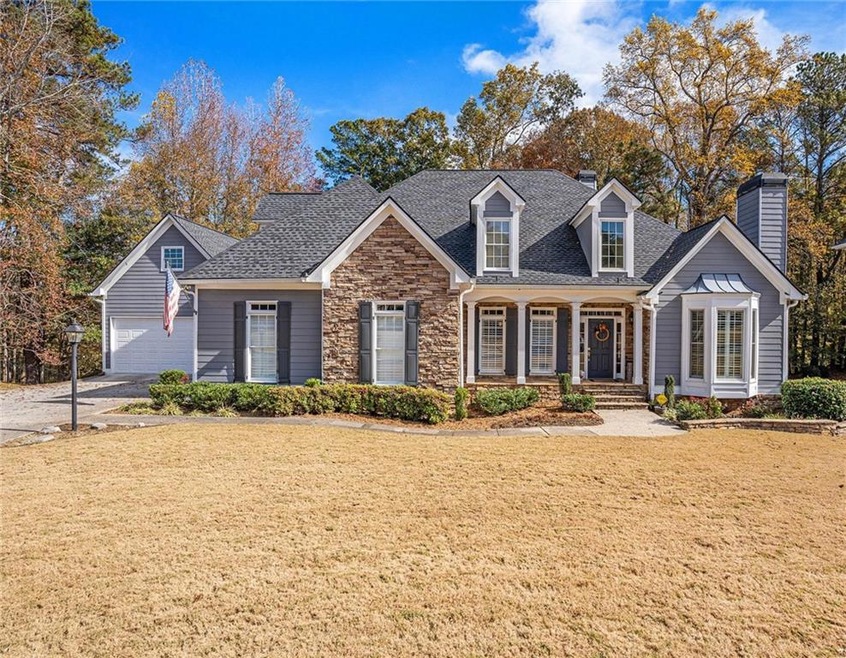 View of front of house with a front lawn and a 4-g