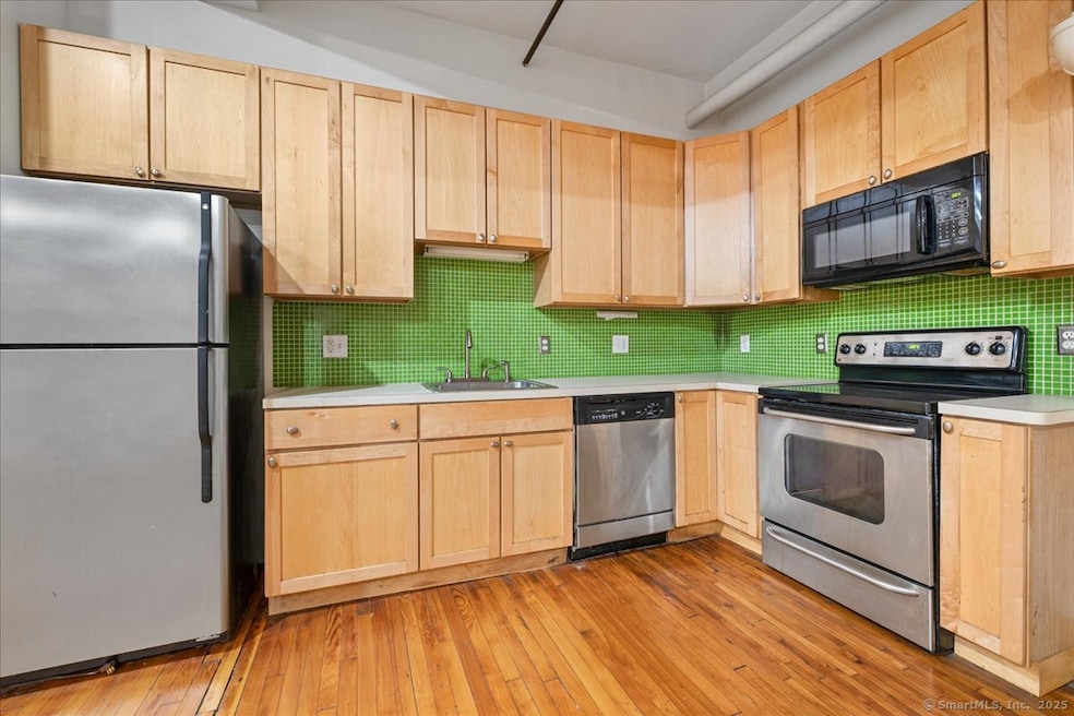 Beautifully laid out updated kitchen with stainless steel appliances, lots of cabinet space and open floor plan to dining room and living room