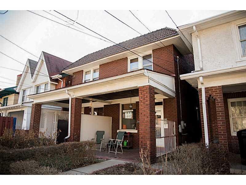Exterior Front. Beautiful Brick home with cozy fro