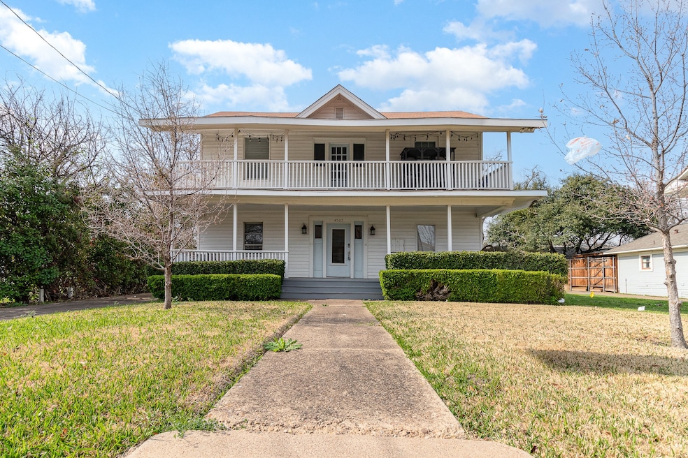 View of front of property with a porch and a front lawn