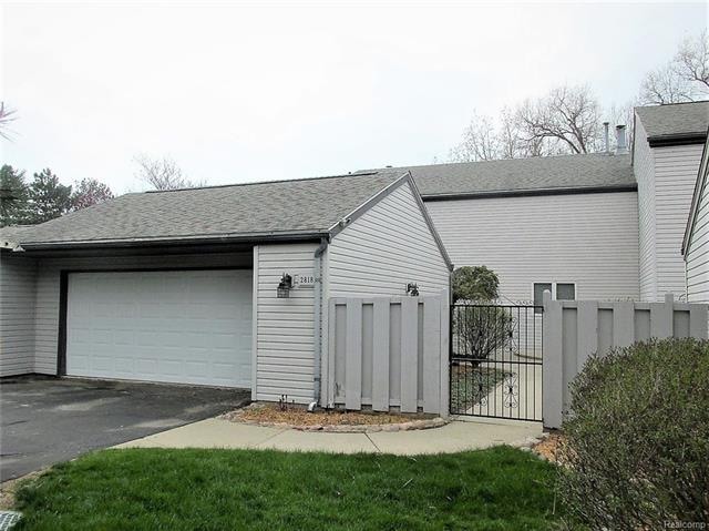 FRONT EXTERIOR W/PRIVATE COURTYARD