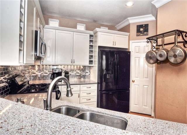 Light and bright remodeled kitchen featuring grani