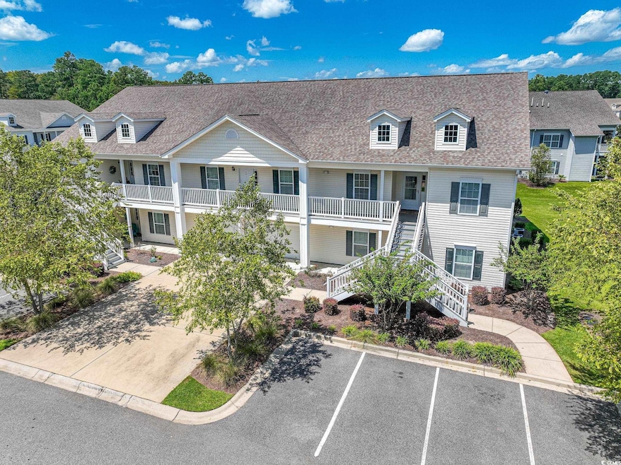 Townhome / multi-family property with a balcony
