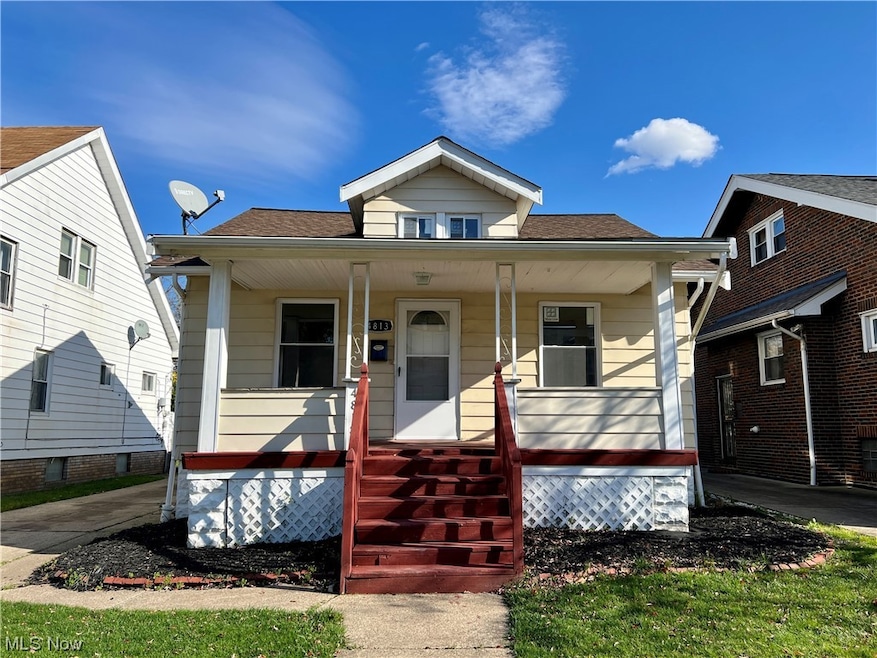 Bungalow-style house with central air condition unit and covered porch