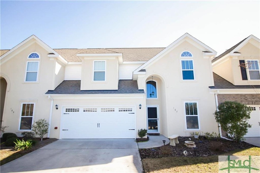 Front view of this upscale townhouse with a 2 car 