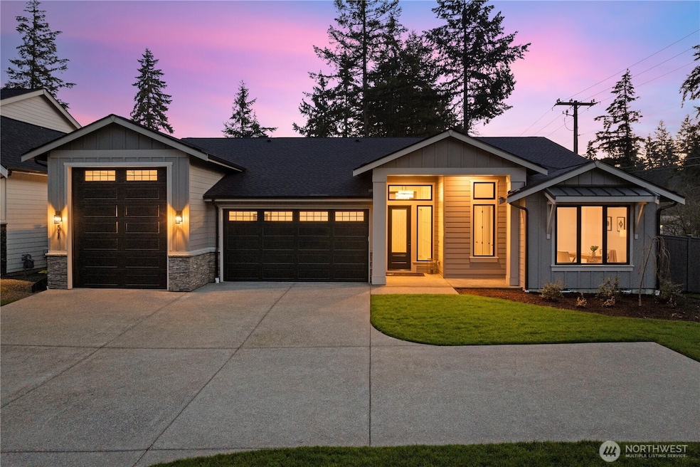 This elegant single-level home features an abundance of parking both inside and out.