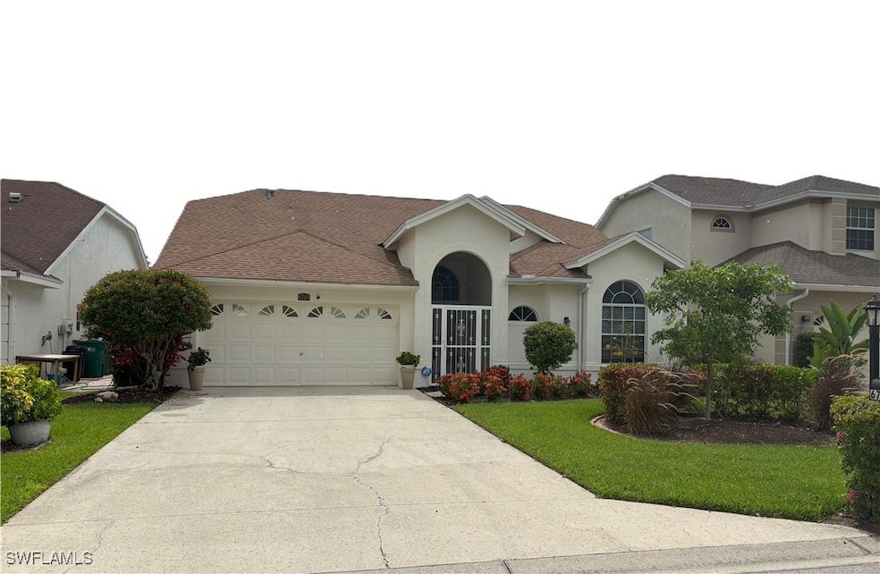 View of front of property with an attached garage,