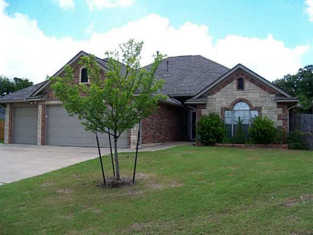 Exterior Front. New 50 year Warranty High Impact Roof, Warranty Transferable, Complete guttering, Sprinkler System, Insulated garage doors.  Flush mounted Storm Shelter in garage.