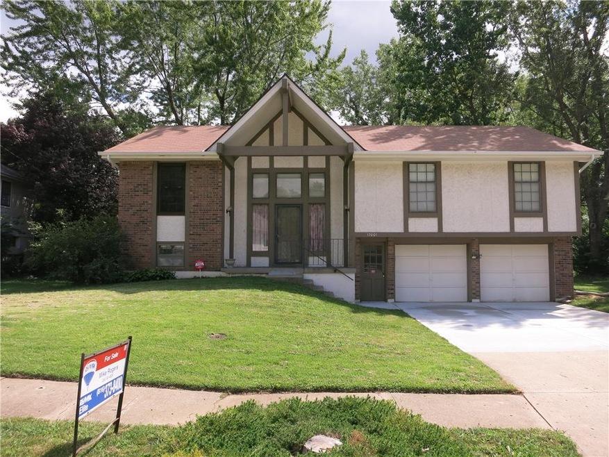 Home faces north and adjoins wooded acreage at rea