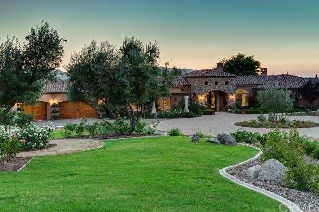 FRONT VIEW OF THIS PROFESSIONALLY LANDSCAPED ESTAT