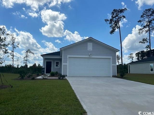 Single story home with a garage and a front yard