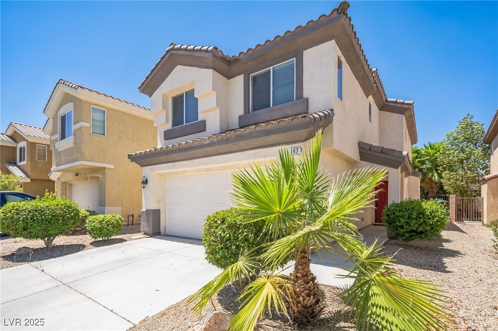 Mediterranean / spanish-style home featuring stucco siding, concrete driveway, a tile roof, and a garage