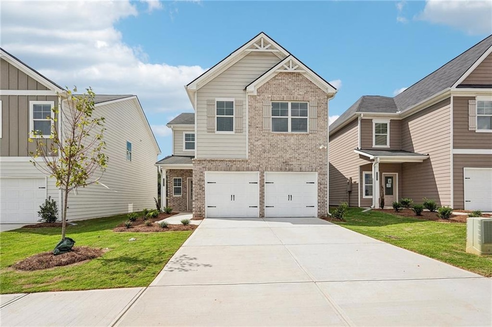 Craftsman inspired home with cooling unit, a garag
