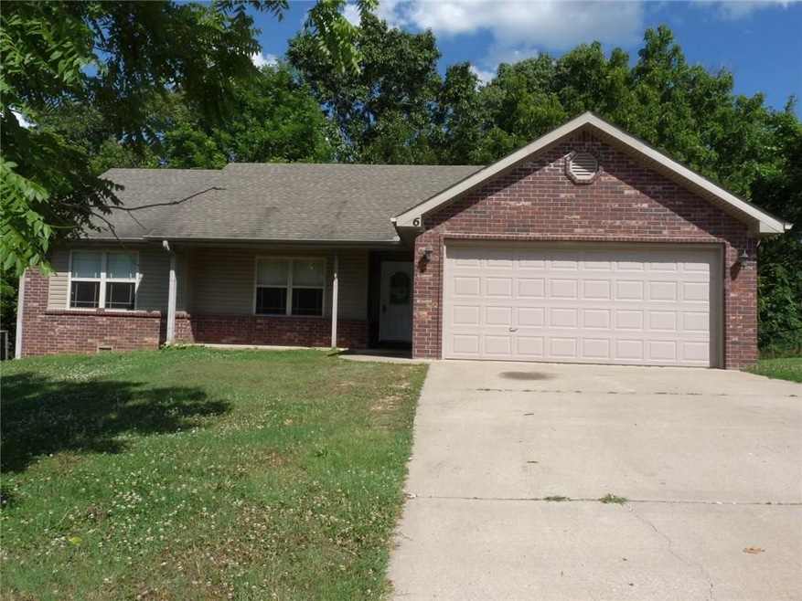 Maintenance-free exterior with brick and vinyl siding.