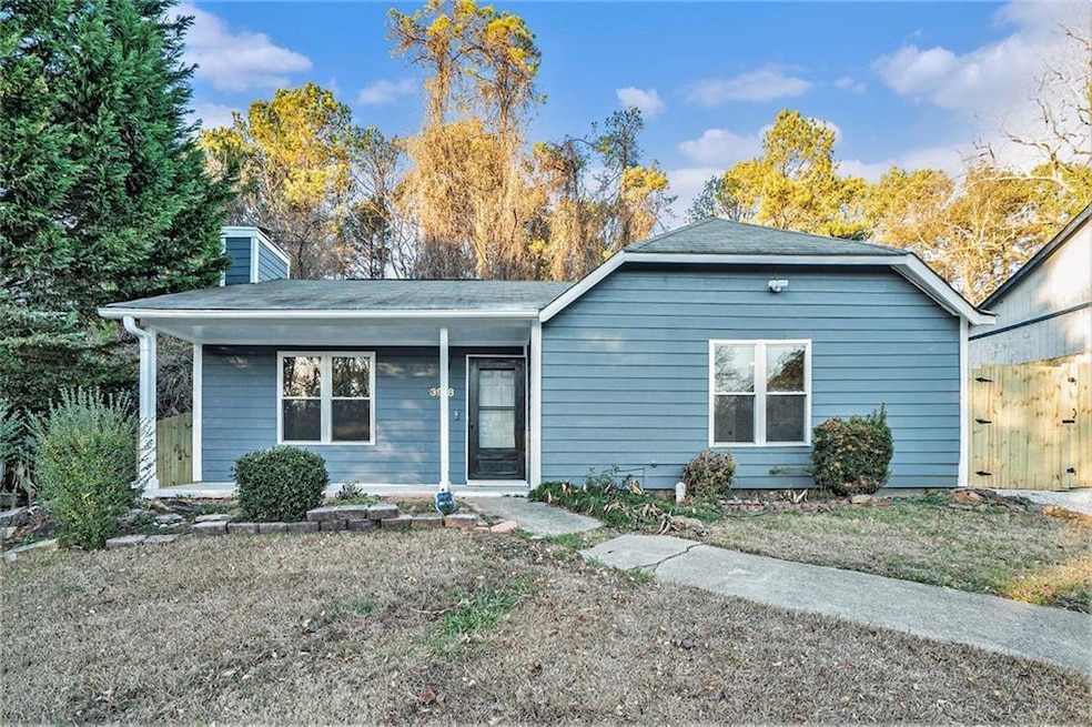 View of front of property with a chimney and a porch