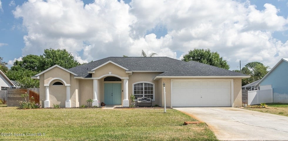 View of front of property featuring stucco siding, concrete driveway, a garage, and a shingled roof