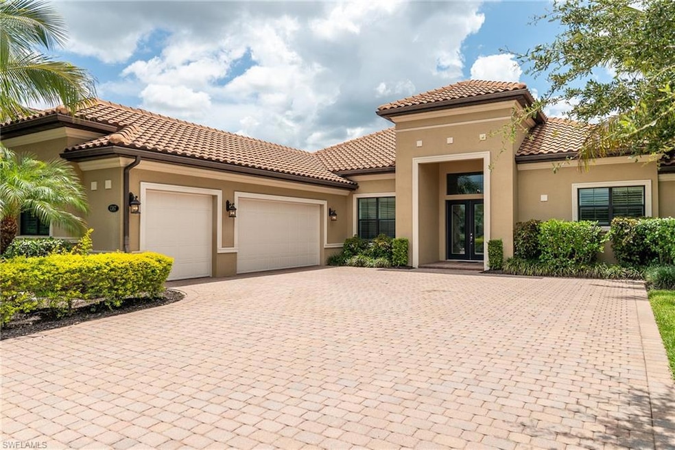 Paved driveway and 3 car garage