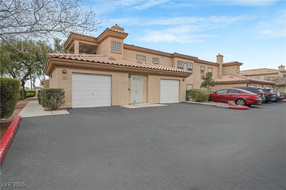 Mediterranean / spanish-style home with aphalt dri