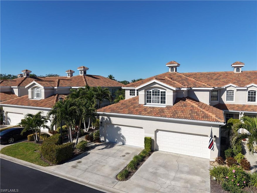 View of front of property with a garage on left