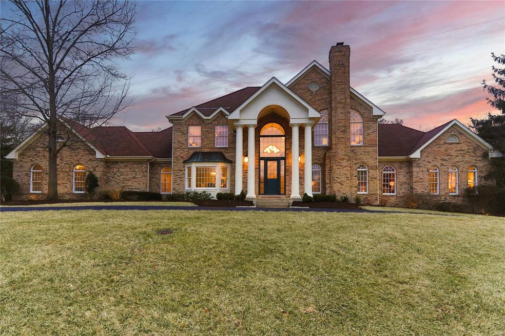 Traditional executive style located in beautiful Weston Place, a community adjoining Queeny Park