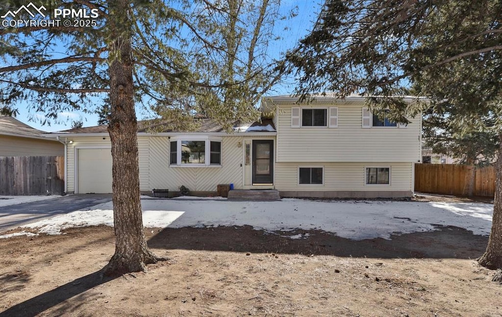 Split level home featuring a garage