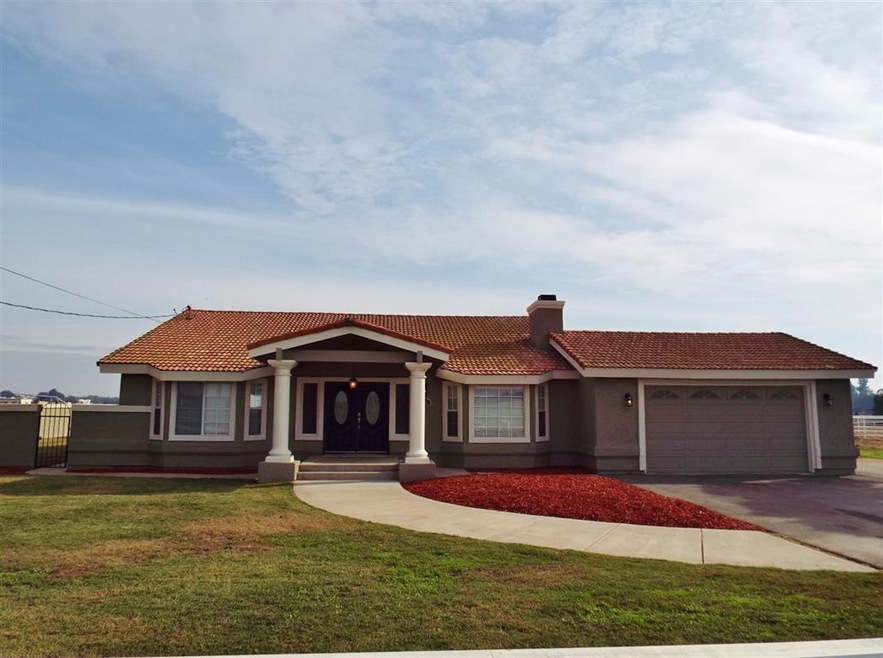 Custom Ranchette 4 bedroom 2 bath home with nearly