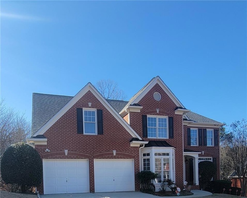 View of front facade featuring a garage