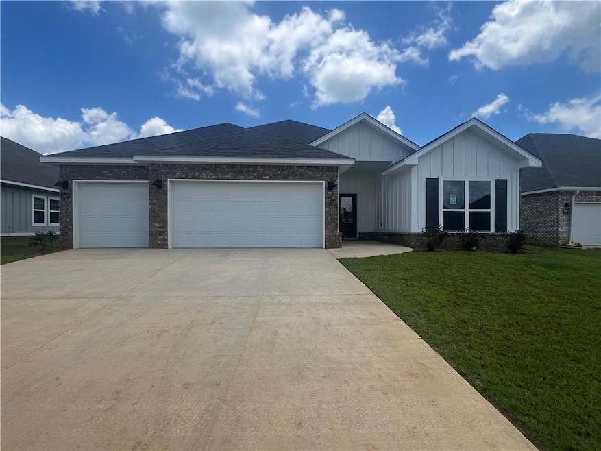 View of front facade featuring a garage and a fron