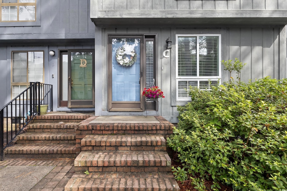 Property entrance with board and batten siding