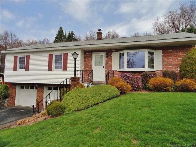 Front exterior with spacious two car garage