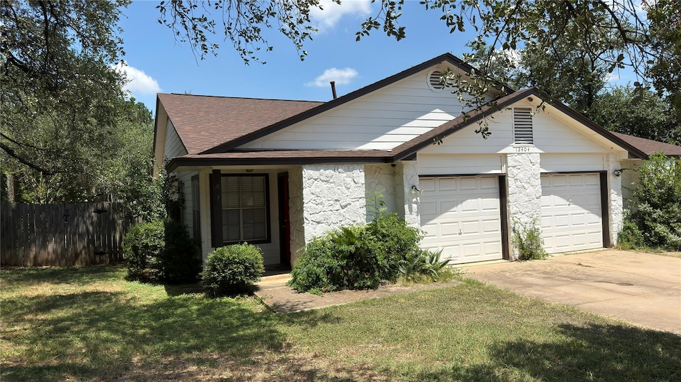 View of front of house featuring driveway, stone 