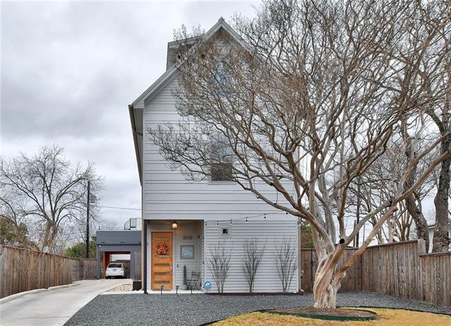 This stunning, modern home sits on a quiet street 