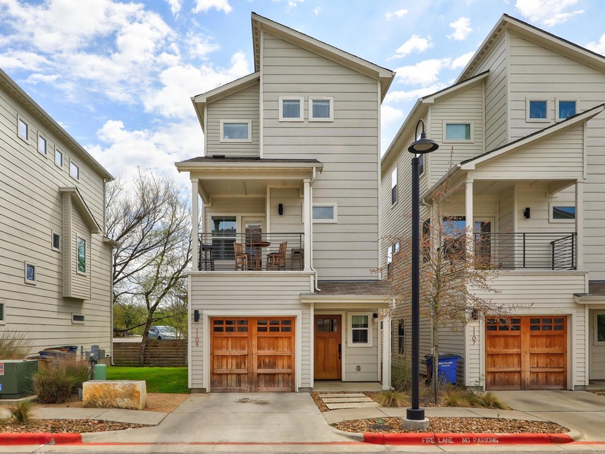 Contemporary house with a balcony, a garage, and 