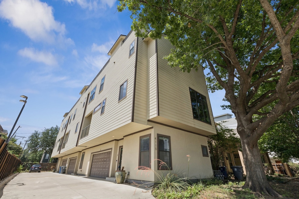 View of property exterior featuring an attached garage, driveway, and stucco siding