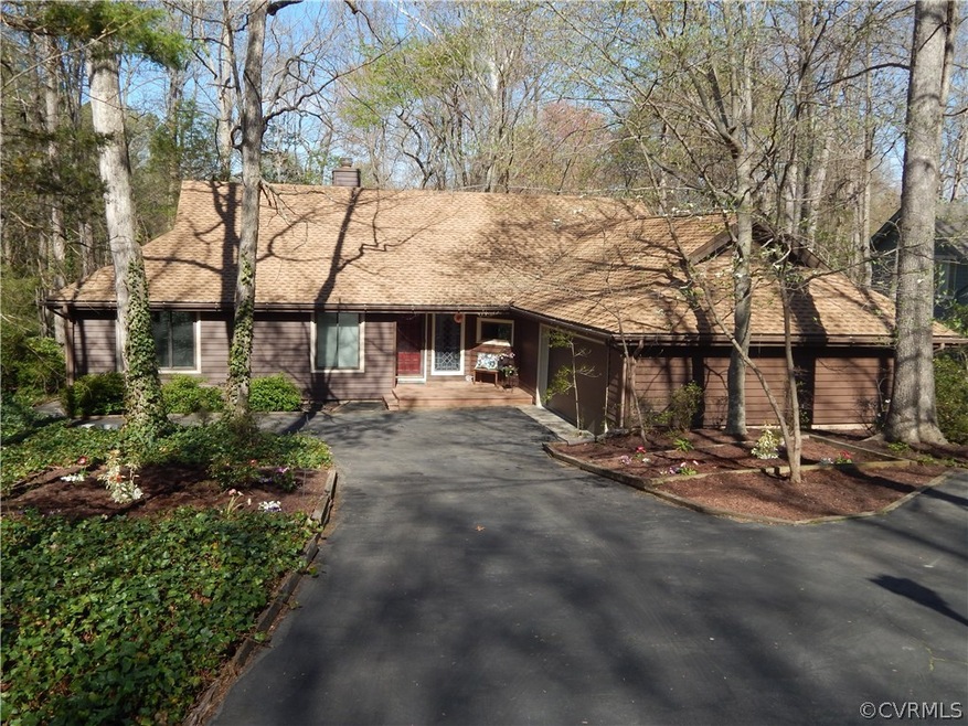 Low maintenance wooded yard with lots of parking