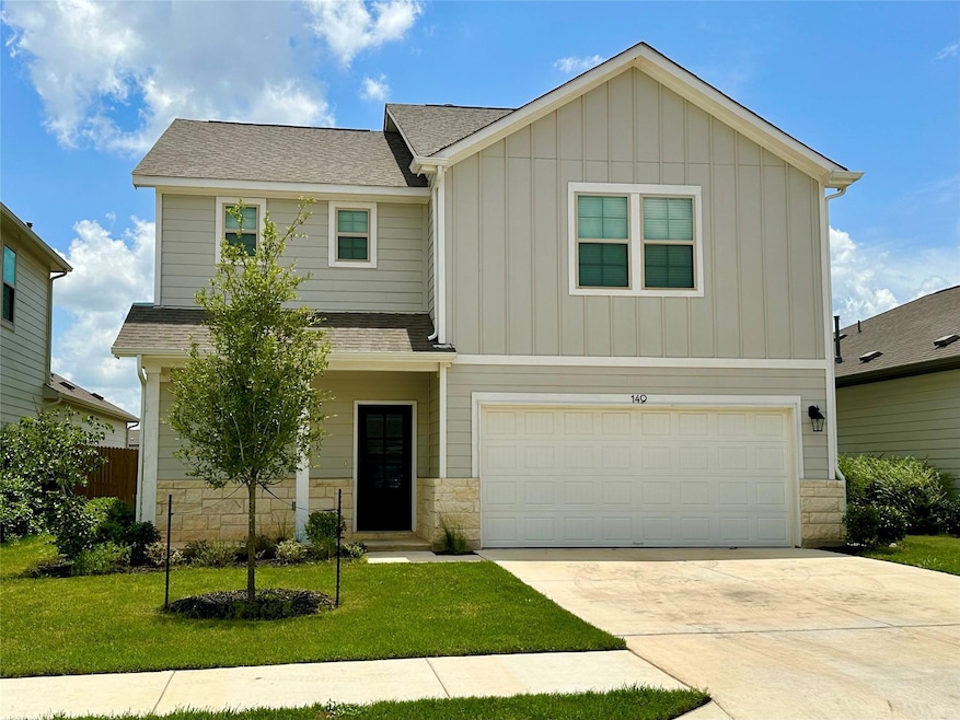 View of front of home featuring board and batten 