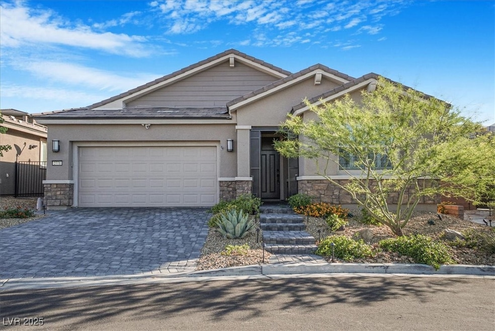 View of front facade with stone siding, stucco sid