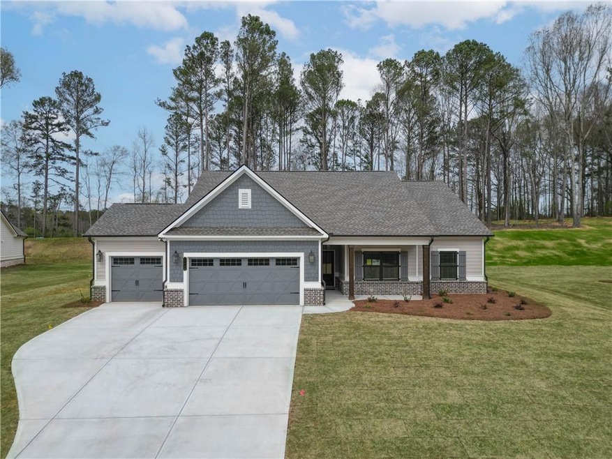Craftsman inspired home with a garage and a front 