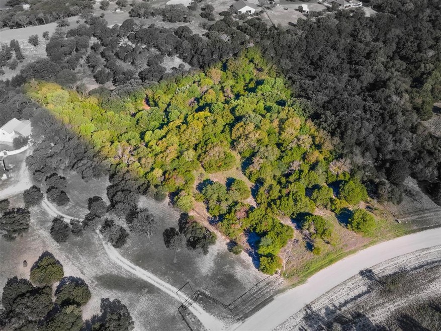 Lot has beautiful trees that you can nestle your h