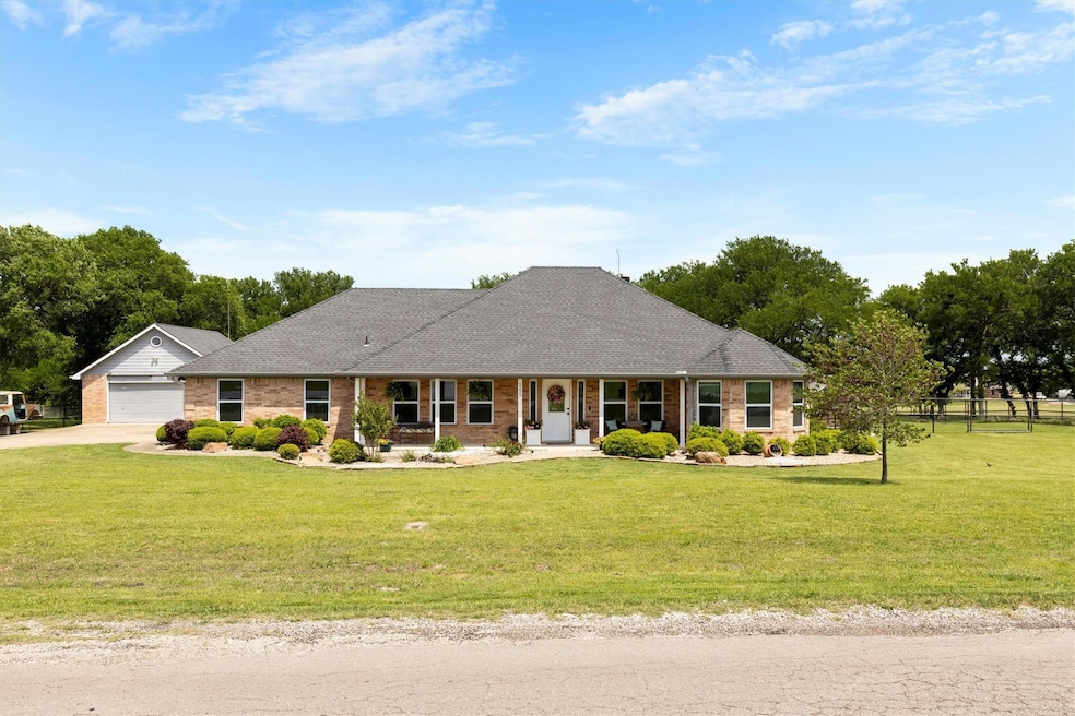 Custom brick ranch on 2 treed acres, shops and ful
